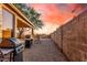 Desert backyard features a barbeque area and desert landscaping with gravel groundcover and a block wall at 6520 E Hacienda La Noria Ln, Gold Canyon, AZ 85118