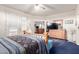 Spacious primary bedroom with a ceiling fan, private patio doors, and a TV sitting on a wooden dresser at 6520 E Hacienda La Noria Ln, Gold Canyon, AZ 85118