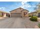 Charming single-story home featuring a two-car garage, low maintenance desert landscaping, and a neutral color scheme at 6520 E Hacienda La Noria Ln, Gold Canyon, AZ 85118