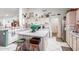 Bright kitchen featuring white cabinets, a center island, modern appliances, and ample counter space at 6520 E Hacienda La Noria Ln, Gold Canyon, AZ 85118