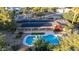 Stunning aerial view of backyard oasis featuring sparkling pool, solar panels, and lush landscaping at 6615 E Desert Cove Ave, Scottsdale, AZ 85254