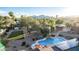 Aerial shot of backyard featuring horse property, a pool, and mountain views at 6615 E Desert Cove Ave, Scottsdale, AZ 85254