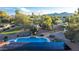 Wide shot of property with pool, solar, turf, and horse property at 6615 E Desert Cove Ave, Scottsdale, AZ 85254