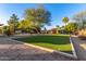 Picture perfect yard with synthetic lawn and landscaping. Perfect for outdoor living and entertaining at 6615 E Desert Cove Ave, Scottsdale, AZ 85254