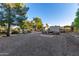 Expansive backyard with a storage shed, lots of open space and mature trees, perfect for outdoor activities at 6615 E Desert Cove Ave, Scottsdale, AZ 85254