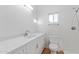 Clean bathroom features a white vanity with quartz countertop, and toilet at 6615 E Desert Cove Ave, Scottsdale, AZ 85254
