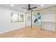 Bright bedroom with mirrored closet doors, a ceiling fan, and a sunny window at 6615 E Desert Cove Ave, Scottsdale, AZ 85254