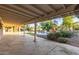 Covered patio provides an ideal space for outdoor entertaining with views of the pool and landscaped backyard at 6615 E Desert Cove Ave, Scottsdale, AZ 85254