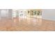 Spacious living room with tile flooring, fireplace, and access to a pool at 6615 E Desert Cove Ave, Scottsdale, AZ 85254