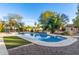 Spacious pool with a synthetic lawn and desert landscaping provides a serene outdoor oasis for relaxation and entertainment at 6615 E Desert Cove Ave, Scottsdale, AZ 85254