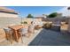 Outdoor patio with dining set and grill, perfect for entertaining and enjoying the backyard at 6630 W Superior Ave, Phoenix, AZ 85043