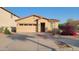 Charming single-story home with a low-maintenance landscaped front yard and attached two-car garage at 6820 S 68Th Ln, Laveen, AZ 85339