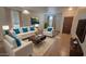 Bright living room with tile floors and ample seating perfect for Gathering gatherings and relaxation at 6820 S 68Th Ln, Laveen, AZ 85339