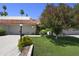 Charming home featuring a terra cotta tile roof, lush landscaping, and a well-manicured lawn at 7114 E Buena Terra Way, Paradise Valley, AZ 85253