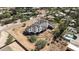Bird's eye view of a new home being built, featuring a tile roof, pool, and lush landscaping at 8125 E Gail Rd, Scottsdale, AZ 85260