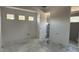 Unfinished bathroom featuring three windows and an open concept floor plan and space for a standing shower at 8125 E Gail Rd, Scottsdale, AZ 85260