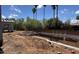 A construction site features an in-ground foundation with rebar and PVC piping at 8125 E Gail Rd, Scottsdale, AZ 85260