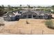 Exterior view of a house under construction, featuring roofing materials and stucco work at 8125 E Gail Rd, Scottsdale, AZ 85260