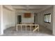 Unfinished kitchen space featuring the framing for the island in a light and open concept layout at 8125 E Gail Rd, Scottsdale, AZ 85260