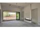 Bright living room with modern fireplace, floor to ceiling doors and view of the outdoor area at 8125 E Gail Rd, Scottsdale, AZ 85260