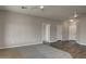 Open-concept living room features wood floors, and neutral walls at 8256 W Mccartney Rd, Casa Grande, AZ 85194
