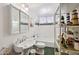 Bathroom with white fixtures, tub, and nautical decor at 8637 E Solano Dr, Scottsdale, AZ 85250
