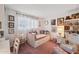 Cozy bedroom with daybed, plush carpet, and decorative wall art at 8637 E Solano Dr, Scottsdale, AZ 85250