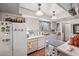 Functional kitchen with white appliances, ample cabinet space and tiled flooring at 8637 E Solano Dr, Scottsdale, AZ 85250