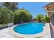 Backyard pool featuring a well maintained interior, concrete surround, and lush landscaping, creating a private oasis at 8637 E Solano Dr, Scottsdale, AZ 85250
