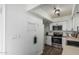 Well-lit kitchen with white cabinets, stainless steel appliances and decorative elements at 9050 N 51St Ln, Glendale, AZ 85302