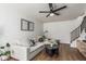 Comfortable living room featuring modern furnishings, hardwood floors, and artwork at 9050 N 51St Ln, Glendale, AZ 85302