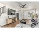 Bright living room featuring hardwood floors, modern furnishings and a ceiling fan at 9050 N 51St Ln, Glendale, AZ 85302