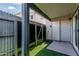 Enclosed patio features artificial grass, storage, and a sliding glass door leading indoors at 9050 N 51St Ln, Glendale, AZ 85302
