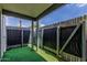 Private fenced-in patio with artificial turf and overhead covering, perfect for outdoor relaxation at 9050 N 51St Ln, Glendale, AZ 85302