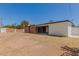 A view of the spacious backyard is showcased in this home with a covered patio at 1028 W 5Th St, Mesa, AZ 85201