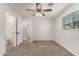Spacious bedroom with en-suite bathroom access and a window for natural light at 1028 W 5Th St, Mesa, AZ 85201