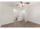 Bright bedroom with a ceiling fan and en-suite bathroom at 1028 W 5Th St, Mesa, AZ 85201