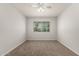 Bedroom showcasing neutral carpet, and a window offering natural light at 1028 W 5Th St, Mesa, AZ 85201