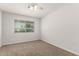 Bedroom with window, carpeted floor and ceiling fan at 1028 W 5Th St, Mesa, AZ 85201
