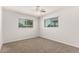 Bright bedroom with carpet, large windows, and a ceiling fan at 1028 W 5Th St, Mesa, AZ 85201