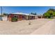 A well-kept single-story home with a gravel yard and traditional brick facade at 1028 W 5Th St, Mesa, AZ 85201