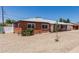 A well-kept single-story home featuring white garage and gravel landscaping at 1028 W 5Th St, Mesa, AZ 85201