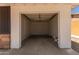 View of an empty single car garage shows a work area and room for parking at 1028 W 5Th St, Mesa, AZ 85201