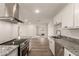 Kitchen with a large island, granite countertops, and modern appliances at 1028 W 5Th St, Mesa, AZ 85201