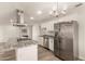 Kitchen with stainless steel appliances, granite countertops, and a view of the dining area at 1028 W 5Th St, Mesa, AZ 85201