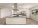 Modern kitchen with granite countertops, stainless steel appliances, and a large island at 1028 W 5Th St, Mesa, AZ 85201