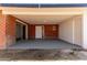 A brick-lined outdoor patio shows a door and sliding door to the residence at 1028 W 5Th St, Mesa, AZ 85201