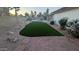 Private backyard with a sparkling pool, artificial turf, gravel landscaping, and mature trees at 1044 N Arvada N --, Mesa, AZ 85205