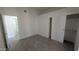 Bedroom with wood-look tile floors, closet, and entry to bathroom at 1044 N Arvada N --, Mesa, AZ 85205