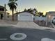 Charming single-story home featuring a desert-landscaped front yard and attached two-car garage at 1044 N Arvada N --, Mesa, AZ 85205